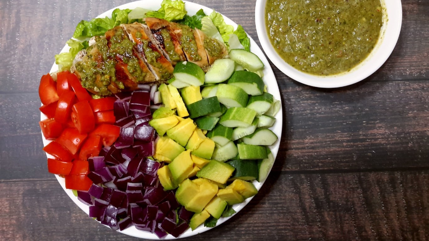Chicken with Chimichurri Sauce in a bowl of Fresh Salad